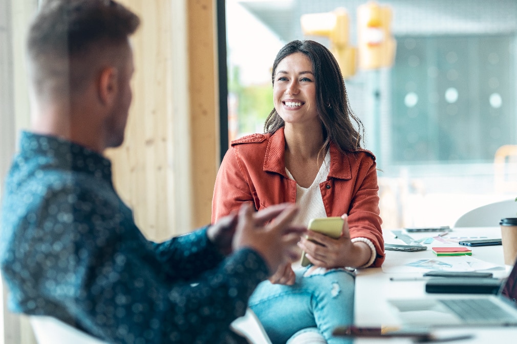 Healthcare working showing a tablet to woman in wheelchair Healthcare working showing a tablet to woman in wheelchair