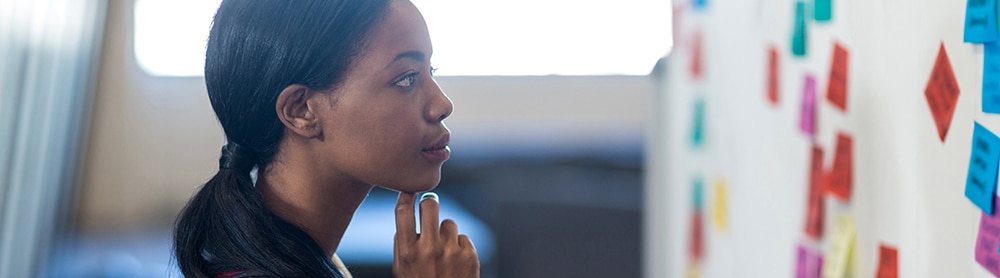 business-agility-mobile-image Woman looking at white board