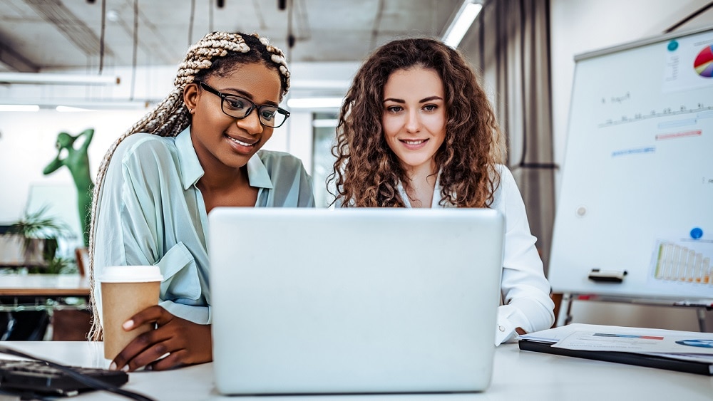 colleagues-collaborating-at-laptop-medium Two collegues collaborating at a laptop