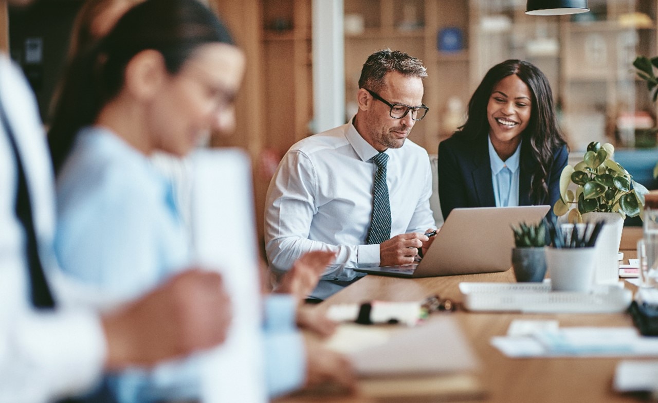 Cybersecurity consultants looking at laptop Cybersecurity consultants looking at laptop