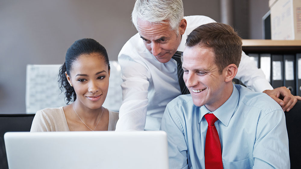 insurance ratabase group working smiling laptop insurance ratabase group working smiling laptop