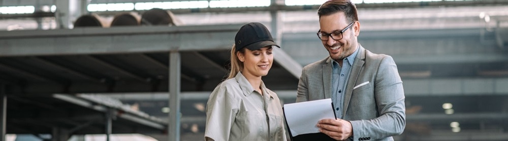 Manager and employee talking at manufacturing factory Manager and employee talking at manufacturing factory