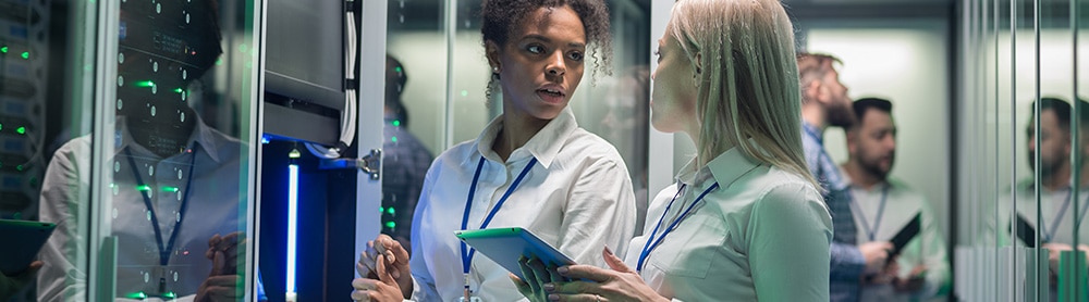 Two security consultants in a server room Two security consultants in a server room