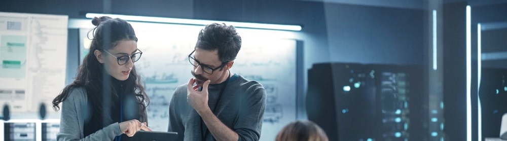 people-working-in-control-room-mobile People working in a computer control room