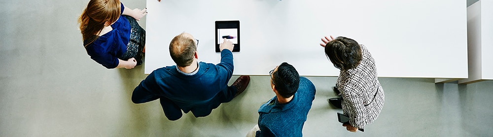 people discuss cybersecurity work team around a table