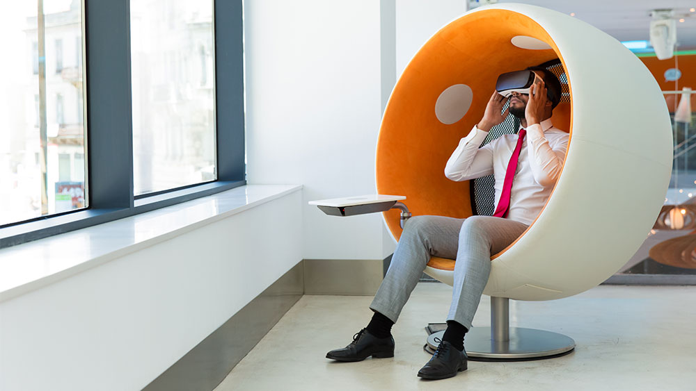 person-sitting-with-virtual-reality-headset person-sitting-with-virtual-reality-headset