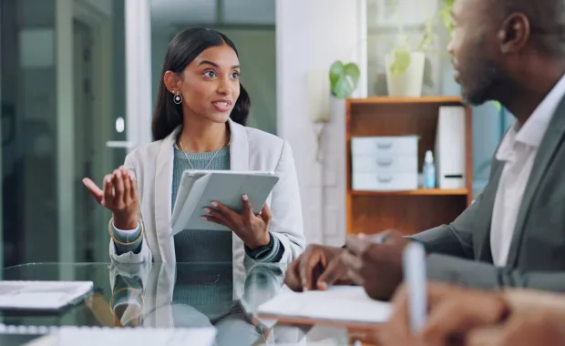 Business woman brainstorming with colleague