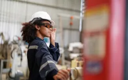 Female worker in metals manufacturing factory