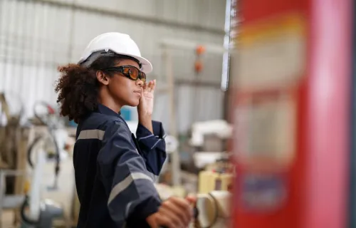 Female worker in metals manufacturing factory