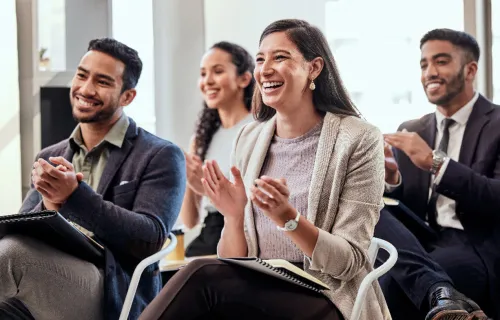 Group of professionals giving applause