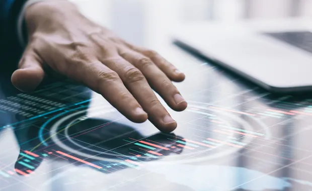 person using touch screen to analyze data