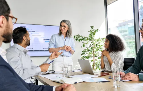 colleagues discussing Novatec around a conference table