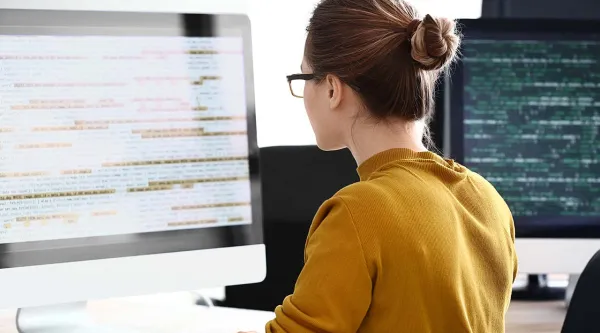 software engineer looking at monitor