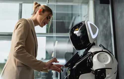 Woman inputting to a humanoid robot