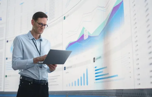 It programer working on computer in a data center 