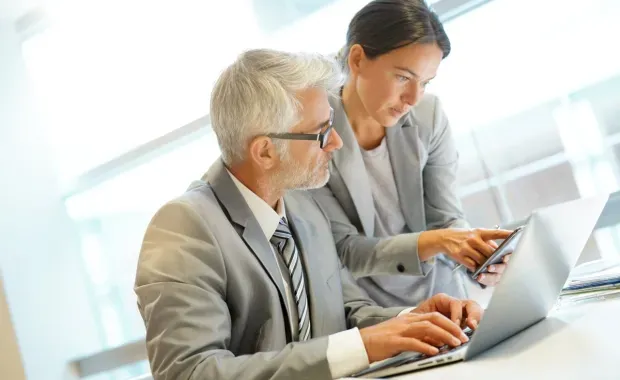 two banking executives discussing AI