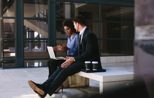 man and woman discussing on their project
