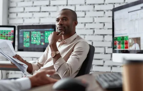 IT consultants reviewing a report IT consultants reviewing a report