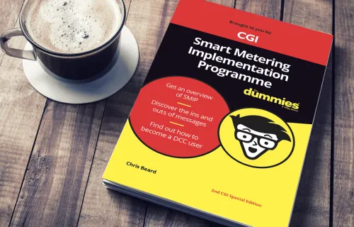 SMIP for Dumies book on a table next to a cup of coffee