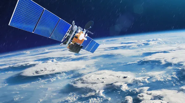 a satellite orbits Earth, representing CGI’s Earth observation capabilities