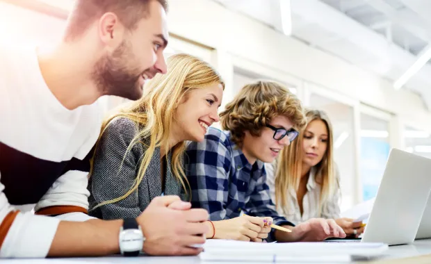 Students studying in front of laptop