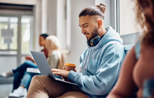 University student wearing headphones