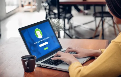 woman using chatbot on laptop